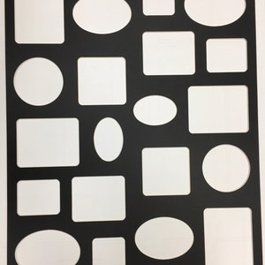 May include: Black craft paper with various sized cut-out shapes, including circles, ovals, and squares. The shapes are arranged in a grid pattern.