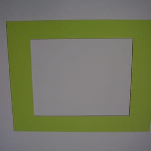 May include: A bright green picture frame with a white mat.