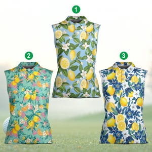 May include: Three sleeveless golf shirts with lemon and floral patterns. The shirts feature a collared neckline and a button-down front. The background is a green field with a golf ball.