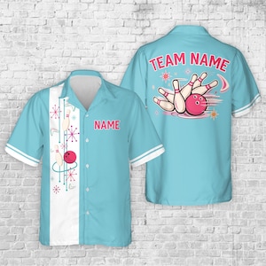 May include: Light blue bowling shirt with a retro design. The front has a white stripe with bowling pins, a red bowling ball, and the text "NAME". The back shows a bowling scene with the text "TEAM NAME".