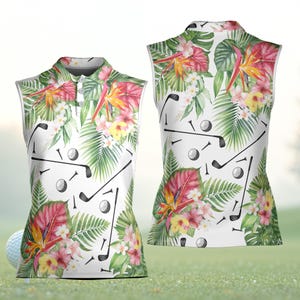 May include: Sleeveless golf shirt featuring a vibrant floral pattern with golf clubs and golf balls on a white background. The shirt showcases a tropical design with pink, yellow, and green leaves and flowers. The shirt has a collared neckline and a button-down front.