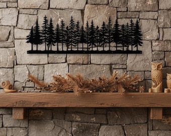 May include: A black metal wall art piece depicting a forest of pine trees. The silhouette of the trees is mounted on a stone wall above a wooden mantel. The artwork adds a rustic touch to the room.