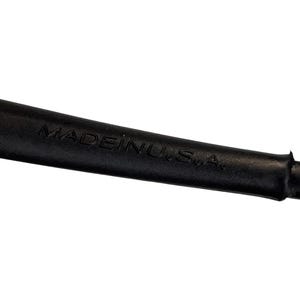 May include: Close-up of a black object with the text "MADE IN U.S.A." embossed on its surface. The object appears to be made of a flexible material.