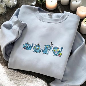 Playful Blue Cat Embroidered Sweater – Whimsical Cartoon Pullover Gift for Pet Lovers, Cat Moms & Cute Cozy Fashion Fans – ESN2553