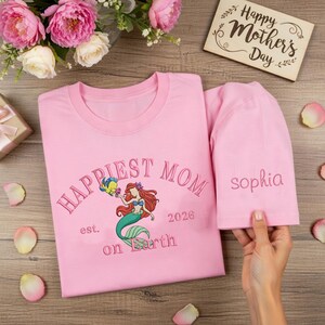 May include: A rustic wooden sign with the text "Welcome to our home" in white lettering. The sign features a distressed finish and a simple, inviting design, perfect for entryway decor.