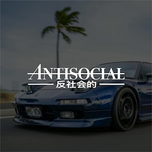 May include: A dark blue sports car with the word "ANTISOCIAL" in white text above Japanese characters. A palm tree is visible in the background. The car has black wheels and a license plate.