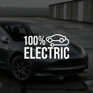 May include: A dark grey electric car with the text "100% ELECTRIC" in white. The text is overlaid on the front of the car, with a graphic of a car and a plug. The car is parked on a wet surface.