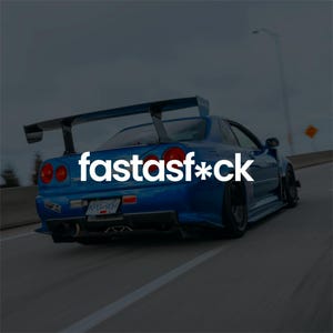 May include: A blue sports car with a large rear spoiler is shown in motion on a highway. The car has red taillights and black wheels. The text "fastasf*ck" is displayed in white across the car's rear.