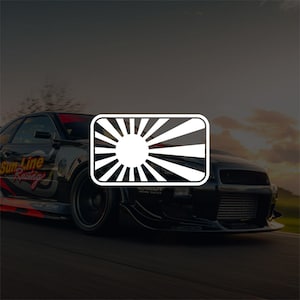 May include: A white and black Rising Sun flag sticker, with a sunburst design, is displayed on a black sports car. The car is in motion on a road, with a sunset in the background. The car has the words "Sun Line Racing" on the side.