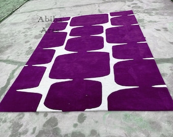 Alfombra geométrica abstracta morada, moderna de mediados de siglo, lavable en lila y blanco para sala de estar o dormitorio.