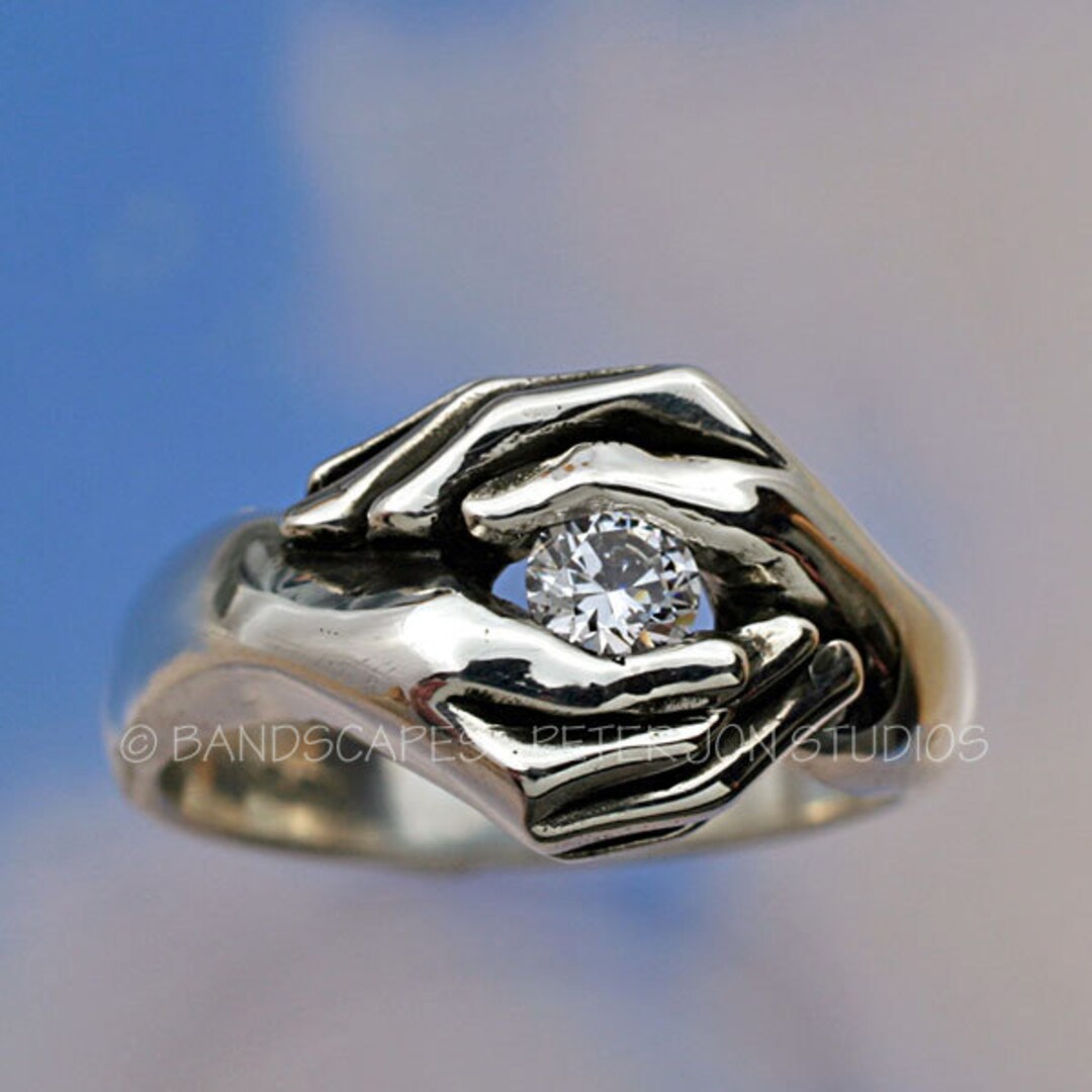 Black and White Picture of Two Hands with Wedding Rings on Black Background  Stock Photo - Image of diamonds, rings: 142110306