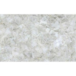 May include: A close-up of a white and gray stone surface with a crystalline appearance. The surface is composed of irregular, interlocking shapes, creating a textured, mosaic-like pattern. The overall effect is a cool, neutral aesthetic.