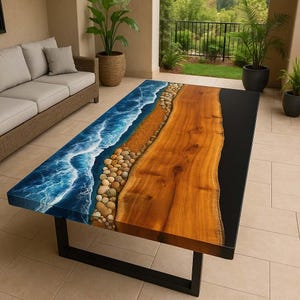 May include: A rectangular coffee table with a unique design. The table features a wooden surface with a live edge, a black border, and a blue epoxy resin design that mimics ocean waves. The table is supported by a black metal frame.