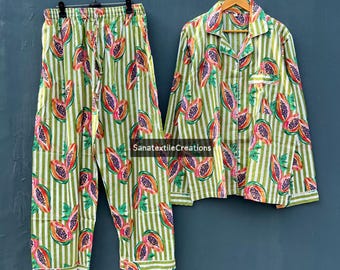 May include: Green and white striped pajama set with a papaya fruit pattern. The set includes a long-sleeved button-down shirt and matching pants. The text "SanatextileCreations" is visible on the bottom right.