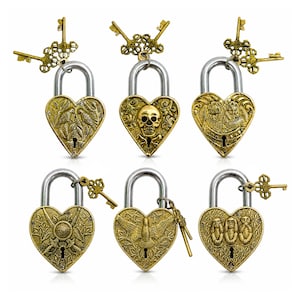 May include: Six heart-shaped padlocks with ornate designs and attached keys. The padlocks are gold-colored with silver-colored clasps. Each padlock features a different embossed design, including leaves, a skull, and an eagle.