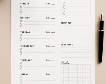 May include: A white A4 weekly planner with a minimalist design. The planner includes sections for each day of the week, priorities, reminders, and notes. A black pen and a cup of coffee are also visible.