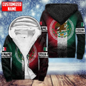 May include: A hooded zip-up jacket featuring the Mexican flag design. The jacket has a white, fluffy interior and a red, white, and green exterior with the Mexican coat of arms. The sleeves have space for a customized name.