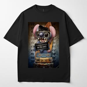 May include: Black t-shirt with a cartoon character wearing sunglasses and holding a surfboard. The character holds a sign that reads "EARTH POLICE 06-16-2002". The graphic is set against a background with luggage. The t-shirt is a casual wear item.
