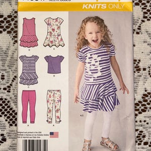 2014 Simplicity Knits Pattern 1435, Childs Girls Knit Dress, Top, Capri Leggins Size A, 3 to 8 Factory Folds