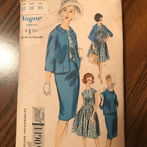 May include: Vintage Vogue pattern 5521 featuring illustrations of women's fashions. The cover art showcases a blue suit and dress designs. The pattern includes bust sizes 32 and 34 inches, and waist sizes 25, 26, and 28 inches.