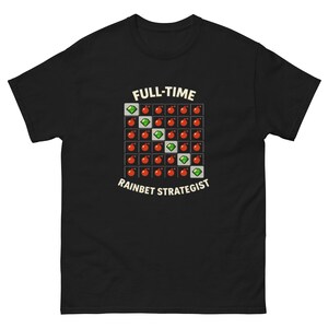 May include: Black t-shirt with the text "FULL-TIME RAINBET STRATEGIST" in a cream-coloured font. The shirt features a grid pattern of red circles and green diamonds.