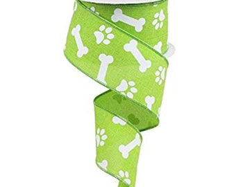 May include: Green and white ribbon with a paw print and bone pattern.