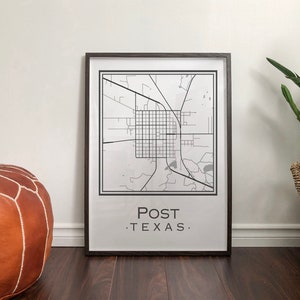 May include: A black and white map print of Post, Texas in a black frame. The map shows the city streets and surrounding area. The print is on a white background and has the text "POST. TEXAS." at the bottom.