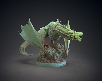 May include: A detailed sculpture of a dragon with a rider, in a muted green colour. The dragon has large, textured wings and a detailed head, perched atop a rocky base. The rider is small and detailed.