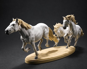 May include: A sculpture featuring two white horses with light tan manes and tails in a dynamic running pose. The horses are positioned on an oval, tan-colored base that mimics a sandy surface, capturing the motion of the animals in mid-stride.