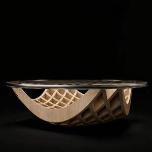 May include: A circular coffee table featuring a light-toned wooden base with a curved, lattice-style grid structure. The tabletop is a flat, circular surface with a dark, reflective finish and a thin, polished metallic edge trim.