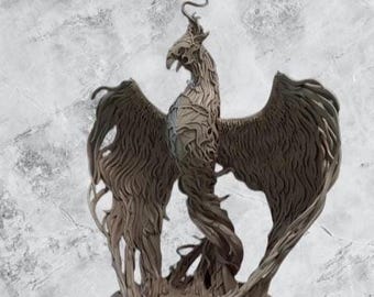 May include: A brown, sculpted figurine of a phoenix with its wings spread wide. The bird features intricate, flowing, vine-like textures throughout its body and feathers, with a long, curved neck and a crest atop its head, standing on a base.
