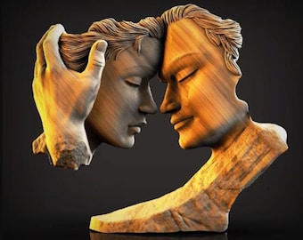 May include: A wooden sculpture depicting two faces in a moment of connection. One face is in a lighter tone, while the other is in a darker tone. The sculpture is set against a dark background, highlighting the details of the carved wood.