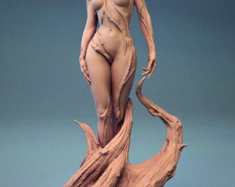 May include: A nude female figure sculpture with flowing hair and intricate leaf-like details. The figure stands on a textured, tree-like base, all in a muted, earthy tone. The sculpture has a serene expression and is set against a blue background.