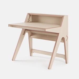 May include: A light-colored wooden desk with a minimalist design. The desk features a slanted writing surface, a small shelf, and angled legs. The desk is made of light-colored wood and has a natural finish. The desk is designed for small spaces.