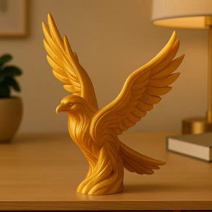 May include: A golden eagle sculpture with outstretched wings. The bird is carved with detailed feathers and stands on a wooden surface. The sculpture is a decorative item, possibly for a home or office.