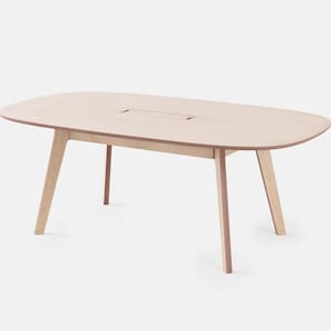 May include: A light-colored, oval-shaped wooden table with four angled legs. The table has a rectangular cutout in the center. The table is approximately 60 inches long and 30 inches wide.