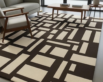 May include: A modern area rug with a geometric pattern. The rug features a repeating design of rectangular shapes in a dark brown and cream color scheme. The rug is placed in a living room setting with furniture.