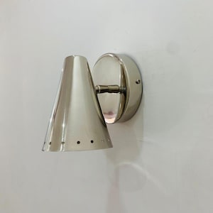 May include: A white ceramic mug with a black handle and the text "But First, Coffee" in a black, bold font. The mug is approximately 10 cm tall and holds about 350 ml of liquid.