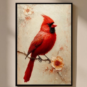May include: A framed painting depicting a bright red cardinal bird on a branch with flowers. The bird has a black mask and crest, set against a textured, off-white background. The artwork is in a black frame.