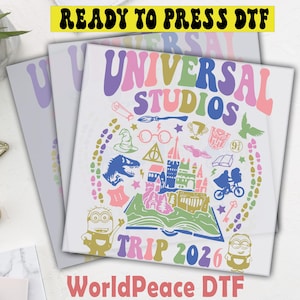 May include: A white ceramic mug with a black handle and the text "But First, Coffee" in a bold, black font. The mug is set against a neutral background, highlighting its simple design.