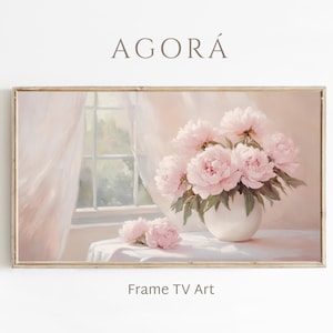 May include: A framed artwork depicting a still life of pink peonies in a white vase on a table. The painting has a soft, pastel colour palette with a window and curtains in the background. The text "AGORÁ" and "Frame TV Art" are visible.