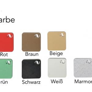 May include: Image displaying a color palette with the word "Farbe" above. The palette includes square samples in red, brown, beige, green, black, white, and marble. Each square has a small hole in the top corner.