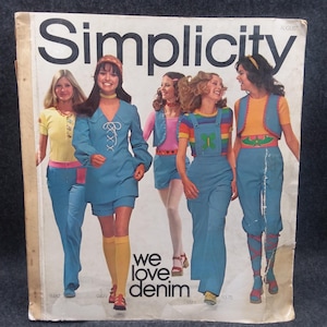 May include: Vintage Simplicity sewing pattern cover featuring the word "Simplicity" in large, bold letters. The cover showcases several women modeling denim outfits, including jumpsuits, shorts, and pants. The text "We love denim" is also visible.