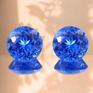 Matched pair Braziliaanse blauwe edelstenen: ronde gefacetteerde slijpvorm: 11 mm