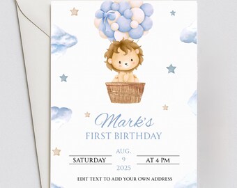 May include: A white invitation card with a watercolor illustration of a lion cub in a hot air balloon. The card reads "Mark's First Birthday" with date and time details. Blue and beige stars and clouds decorate the card.