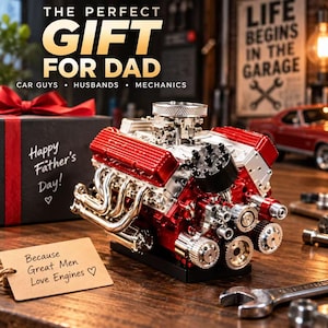May include: A detailed V8 engine model featuring metallic silver and bright red components, including a chrome air filter, exhaust headers, and a black distributor cap. A gift box with text and a tag reading 'Because Great Men Love Engines' are present.