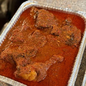 Nigerian Stew  served with Chicken,Beef,goat, fish or assorted meat. Meat options can be mixed