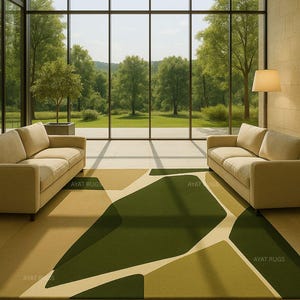 May include: A modern living room with two beige sofas facing a large window overlooking a green landscape. A geometric rug in shades of green and beige covers the floor. The text "AYAT RUGS" is visible on the rug.