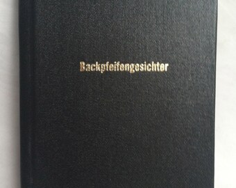 BIG BACKPFEIFENGESICHTER-das GROSS schwarze buch-A Face Needing A Punch