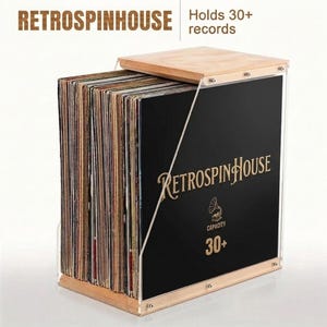 May include: A wooden and acrylic record storage box with the text "RETROSPINHOUSE" and "Holds 30+ records". The box has a wooden base and lid, with a black front panel featuring gold lettering and a gramophone graphic.